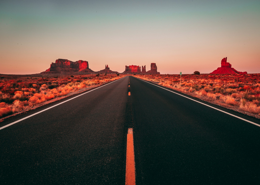 view of a highway in the desert during sunset