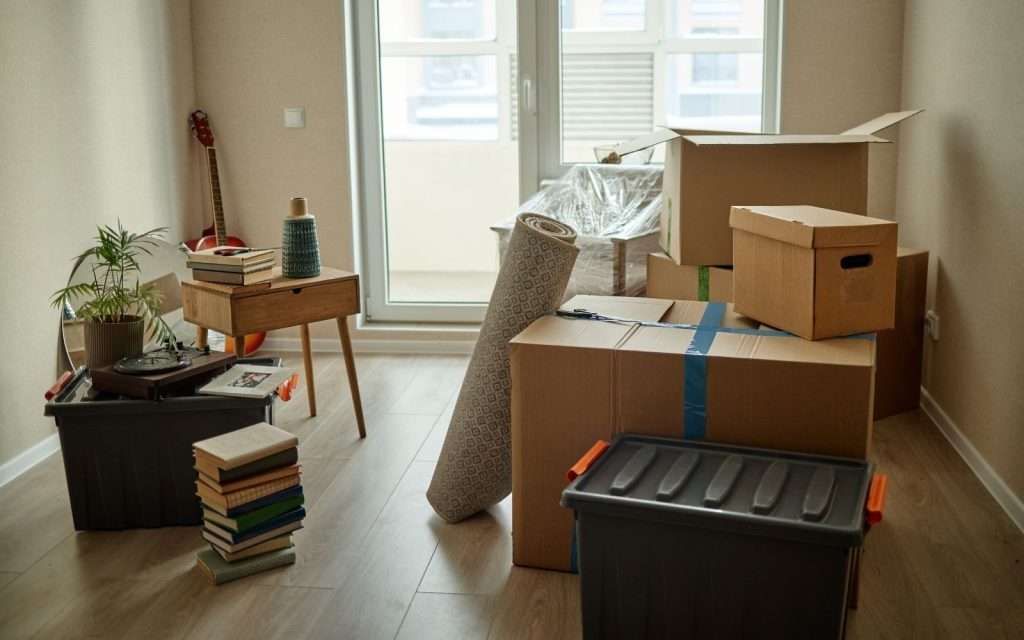 Household goods and boxes packed by movers in San Tan Valley in a room